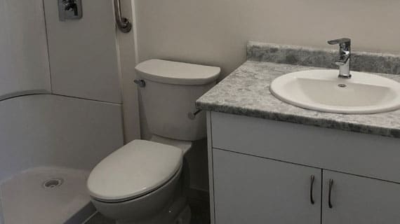 image of a bathroom with sink and shower and toilet