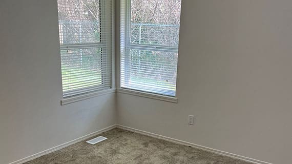 image of a bedroom with windows